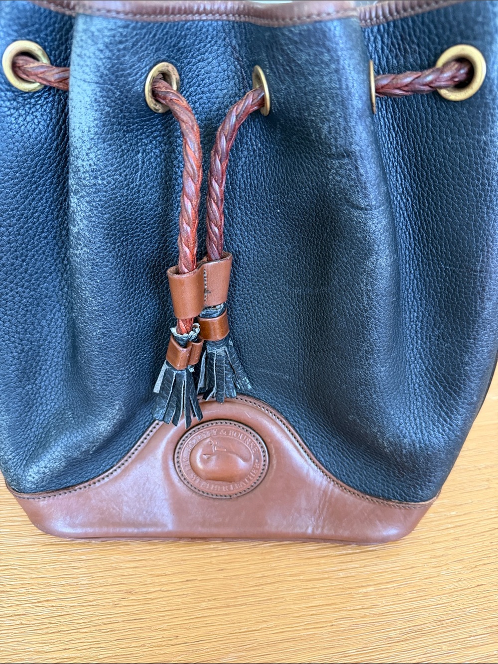 Dooney & Bourke Black Pebble Leather Drawstring Bucket Bag with Brown Trim